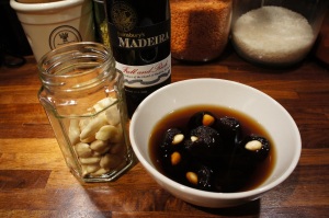 Almond-stuffed prunes soaking in Madeira wine